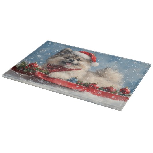 Keeshond Hund in Sledge Lass es Schnee Weihnachten Schneidebrett (Ecke)