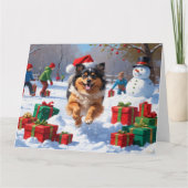Keeshond Hund läuft im Schnee mit Weihnachtshut Karte (Vorderseite)
