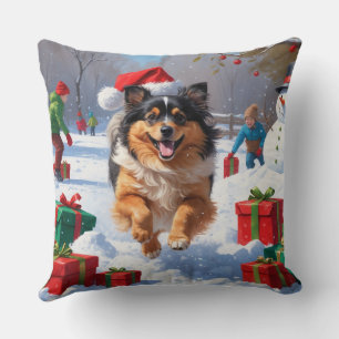 Keeshond-Hund läuft im Schnee mit Weihnachtsmütze Kissen