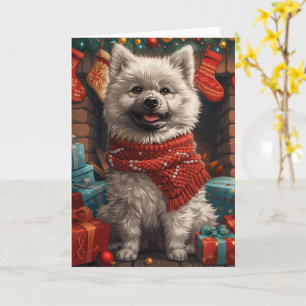 Keeshond-Hund mit Weihnachtsgeschenken Kamin Karte