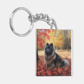 Keeshond im Herbst Leaves Fall Inspiriert Schlüsselanhänger (Vorderseite links)