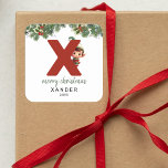 Kids Initial X Christmas Quadratischer Aufkleber<br><div class="desc">Gib dieses Weihnachtsfest das Geschenk personalisierten Charmes! Unsere Monogramm-Aufkleber mit dem Elf des Weihnachtsmannes,  die sich hinter dem Buchstaben X versteckt,  sind eine einzigartige und durchdachte Möglichkeit,  Ihre Liebe zu zeigen. Passen Sie mit einem Namen,  Jahr und einem herzlichen Gruß an. Machen Sie Ihre Weihnachtsgeschenke auffällig!</div>