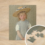 Kind in einem Strohhut | Mary Cassatt Puzzle<br><div class="desc">Kind in einem Strohhut (1886) von der amerikanischen Impressionistin Mary Cassatt. Original-Kunstwerk ist ein Ölgemälde auf der Leinwand, das ein Portrait eines jungen Mädchens in einem übergroßen Strohhut darstellt und einen schlichten grauen Pinavor trägt. Der ernsthafte Ausdruck auf dem Gesicht des Mädchens Set dieses Bild, abgesehen von Cassatts ähnlichen Porträts...</div>