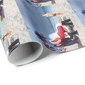 Kind sieht Santa Claus an, am Strand sitzen Geschenkpapier (Rolleneckpunkt)