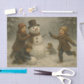 Kinder bauen einen Schneemann Seidenpapier (Handwerk)