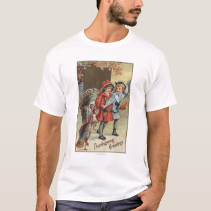 Kinder, die einen Kürbis, Truthähne halten T-Shirt