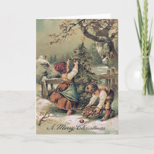 Kinder, die Weihnachtsschnee dekorieren Feiertagskarte