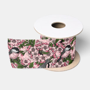 Kirschblüte und Kichererbsen auf rosa Satinband