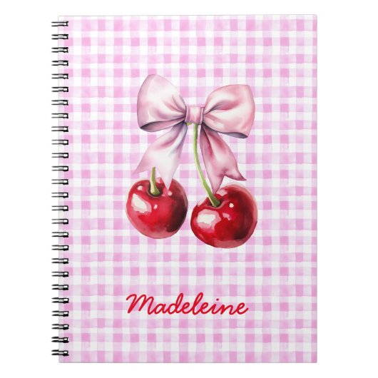 Kirsche mit süßem rosa Schleifchen auf Gingham mit Notizblock (Vorderseite)
