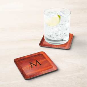 Kirschholzstruktur mit individuellem Monogramm. Getränkeuntersetzer