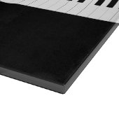 Klavier spielt Musikinstrument mit der Tastatur Schneidebrett (Ecke)