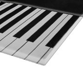 Klaviertastatur und musikalische Bemerkungen Schneidebrett (Ecke)
