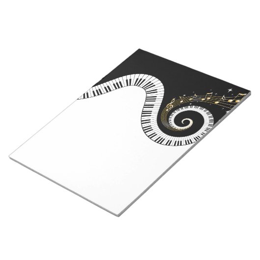 Klaviertasten und Gold-Musiknoten Notizblock (angewinkelt)