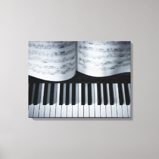 Klaviertasten und Musikbuch Leinwanddruck