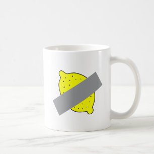 Klebefilmgeklebter gelber Zitronenkunst-Kaffeebech Kaffeetasse