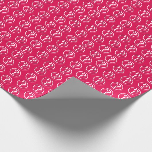 Kleine Fragezeichen in weißem Rosa Geschenkpapier (Ecke)