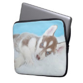 Kleine Husky-Welpe, die auf der Decke spielt Laptopschutzhülle (Vorderseite Links)