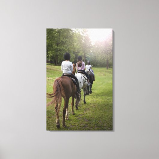 Kleine Mädchen reiten Pferde Leinwanddruck (Vorderseite)