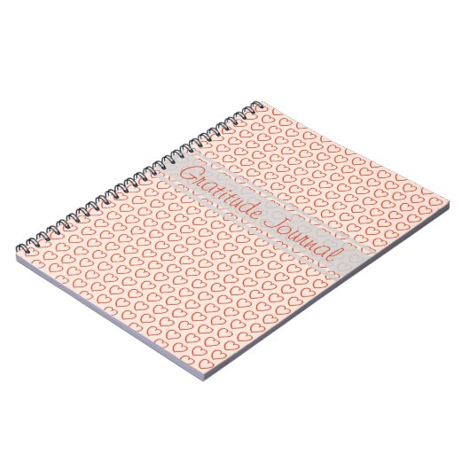 Kleine rote Herzen auf rosa Notizblock (Linke Seite)