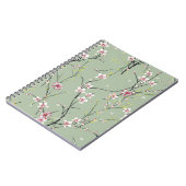 Kleine rote und gelbe Blume auf grünem Hintergrund Notizblock (Linke Seite)