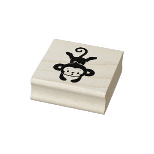 Kleiner Affe legt ab Gummistempel