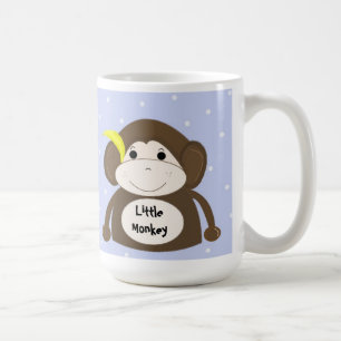 Kleiner Affe mit einer gelben Banane Kaffeetasse