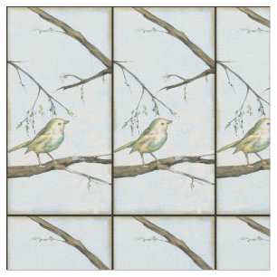 Kleiner gelber Vogel hockte auf einer Stoff