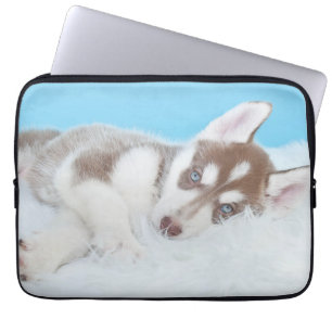 Kleiner Husky-Welpe auf einer Blankette Laptopschutzhülle