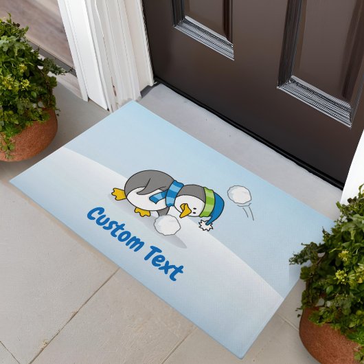 Kleiner Pinguin Erlangung einer Schneeballmatte Fußmatte