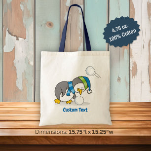 Kleiner Pinguin mit einer Schneeball-Tragetasche Tragetasche