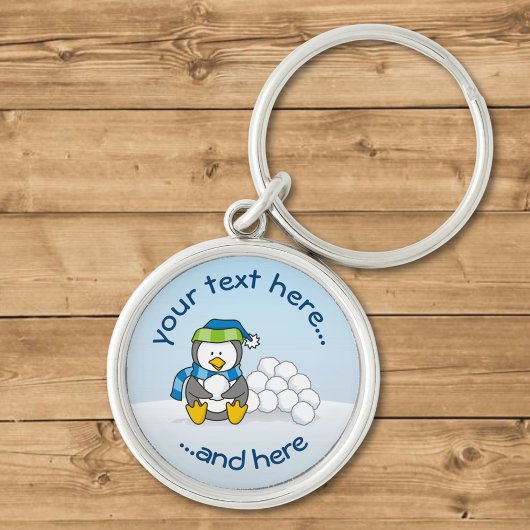 Kleiner Pinguin mit Schneebällen Schlüsselanhänger