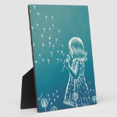 Kleines Mädchen, das auf einen Löwenzahn bläst Fotoplatte (Seite)