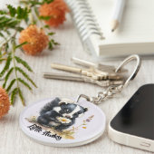 Kleines Stinktier schnüffelt an Gänseblümchen Schlüsselanhänger (Vorderseite rechts)