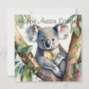 Koala-Bär hält ein goldenes Osterei Karte