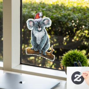 Koala-Bär in einer Weihnachtsmannmütze Fensteraufkleber