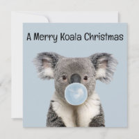 Koala bläst einen blauen Bubble-Gum-Weihnachtsgruß