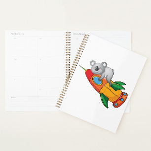 Koala schlafen bei einer farbenfrohen Rakete Planer