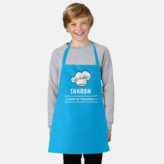 Koch in der Schulung des Koch-Hut-Logos für Kinder Schürze (Getragen)