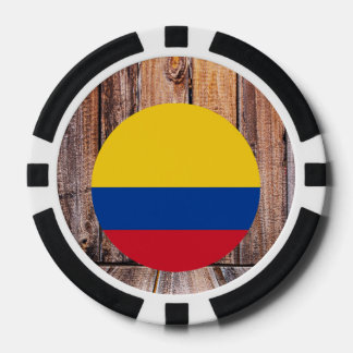 Kolumbien-Flaggenzirkel im Holzhintergrund Pokerchips