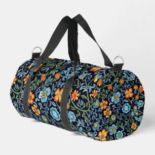Komplexe Blumenkunst: Blaue und orangefarbene Blum Duffle Bag