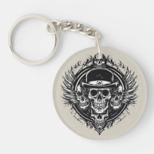 Komplexes Totenkopfdesign mit Flügeln und Symbolen Schlüsselanhänger