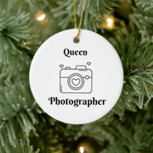 Königin Fotograf mit einer Kamera auf einem Keramik Ornament