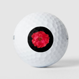 Korallenfarbene Rose auf schwarz Golfball