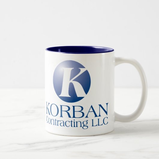 KORBAN CONTRACTING LLC ZWEIFARBIGE TASSE (Rechts)