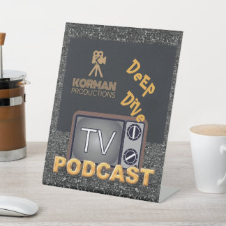 Korman Productions Deep Dive TV Podcast Sockelschild