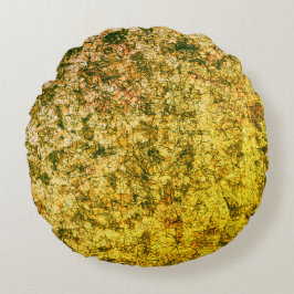 Kratzer auf einem leicht gepunkteten ochgelben rundes kissen