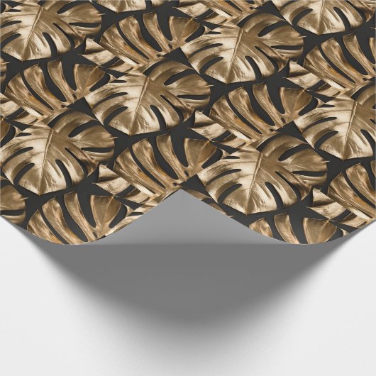 Kreative Monstera-Blätter, schwarzer Hintergrund. Geschenkpapier (Ecke)