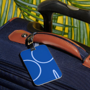 Kreise und Schleife auf blauem Gepäckanhänger