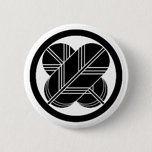 Kreuzende Falkenfedern mit Fuß im Kreis Button