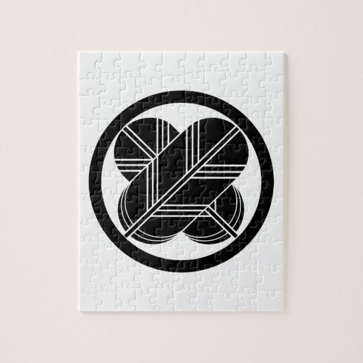 Kreuzende Falkenfedern mit Fuß im Kreis Puzzle (Vertikal)